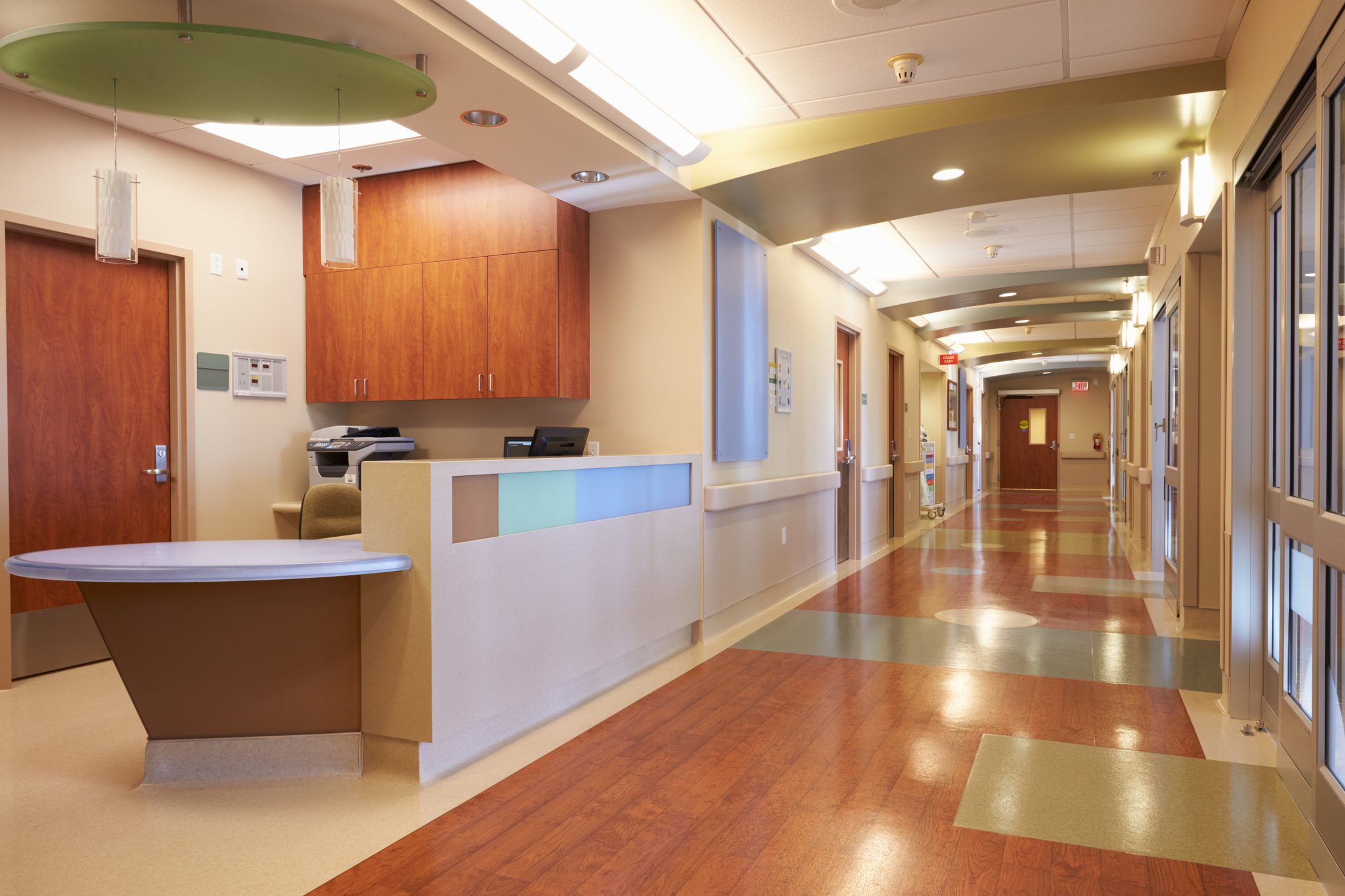 Empty Nurses Station And Corridor In Modern Hospital