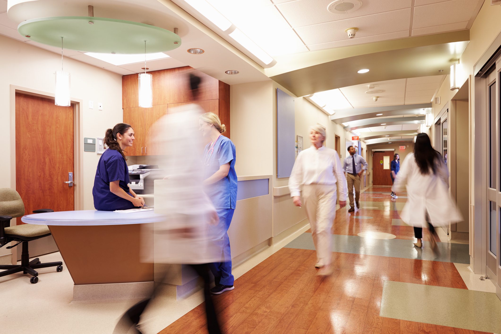 Busy Nurse's Station In Modern Hospital